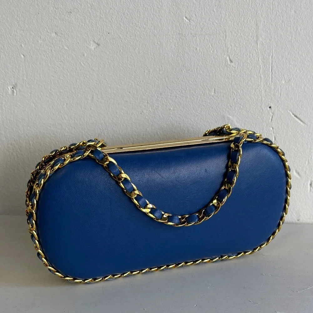 Chic Blue Pill Clutch with Gold Chain Accent